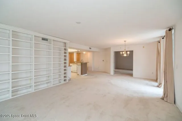 a view of empty room with empty shelves