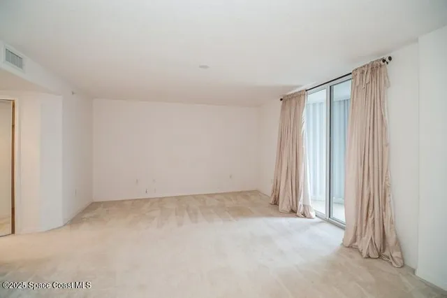 an empty room with a empty space and a window