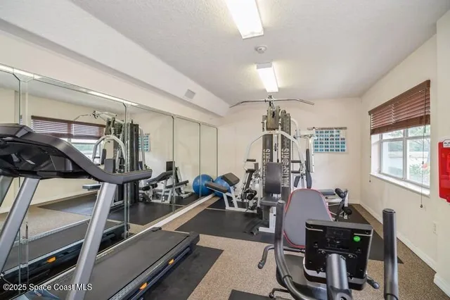 a view of a room with gym equipment