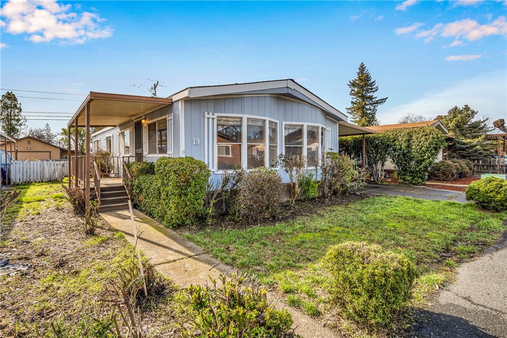 5330 Lakeshore Boulevard, Unit 19 Lakeport, CA 95453 - Photo 1 of 17 a view of a house with backyard and sitting area