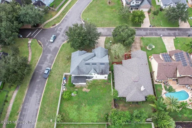 an aerial view of a house with a garden