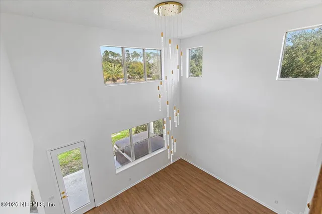 a view of an entryway with wooden floor