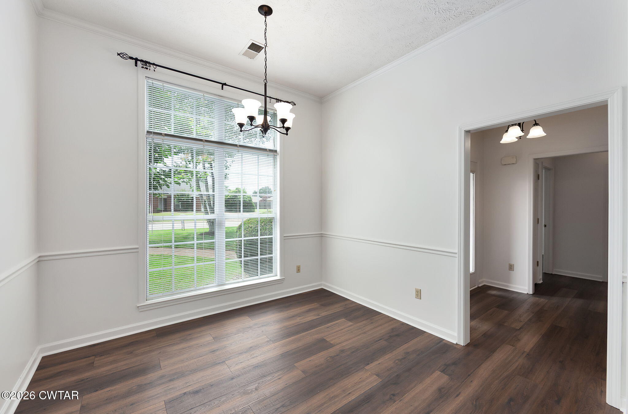 96 Sundown Drive Jackson, TN 38305 - Photo 6 of 28 a view of empty room with wooden floor and window