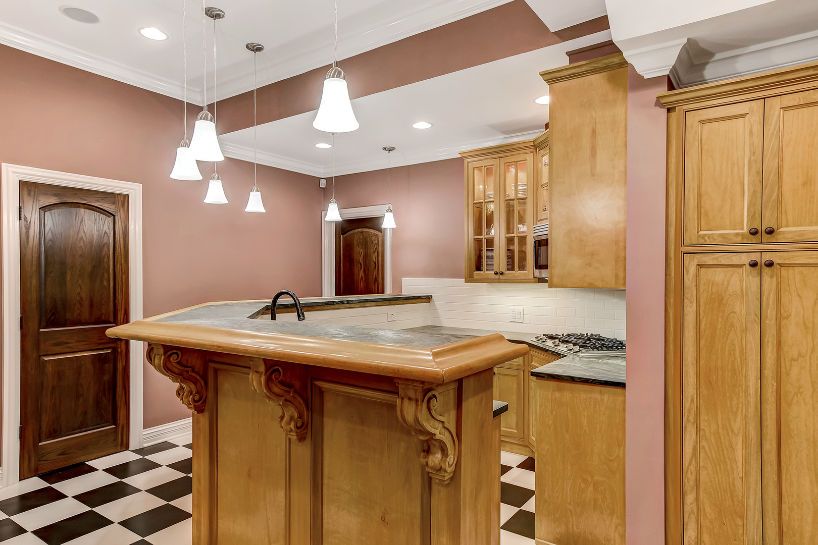 6116 South County Line Road Burr Ridge, IL 60527 - Photo 41 of 66 a kitchen with stainless steel appliances granite countertop a sink a stove and a refrigerator