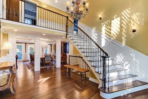a view of entryway livingroom and hall with wooden floor