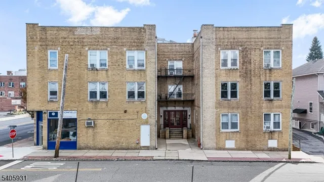 a front view of a building with a street