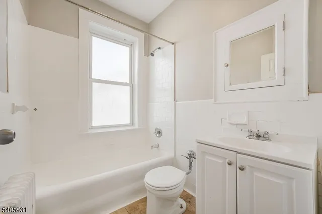 a bathroom with a sink a toilet and a bathtub