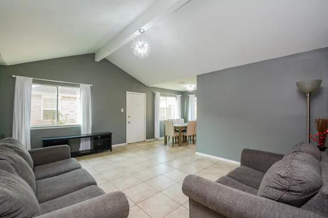 a living room with furniture and a window