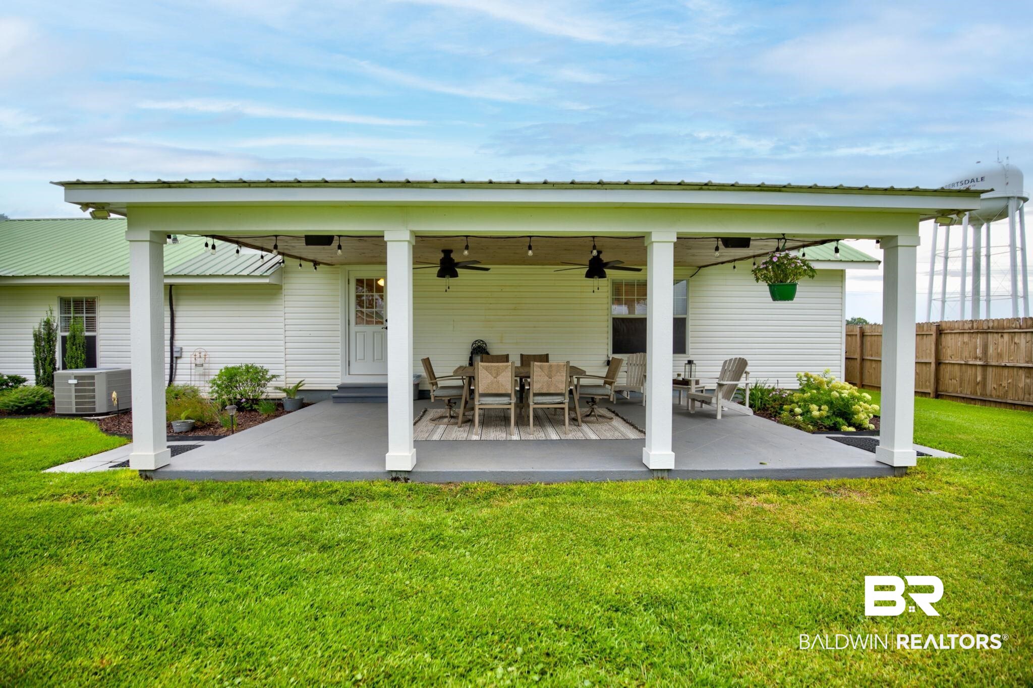 18732 Fairground Road Robertsdale, AL 36567 - Photo 36 of 46 Back of house with central air condition unit, a lawn, and ceiling fan