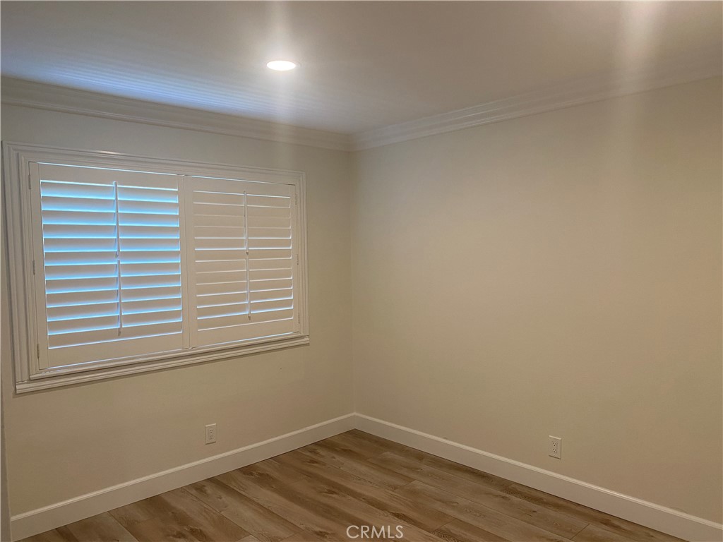 430 Buttonwood Drive Brea, CA 92821 - Photo 15 of 27 an empty room with wooden floor and windows