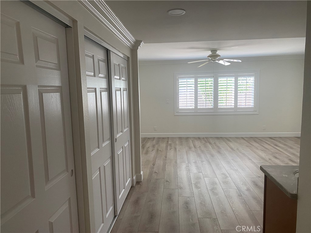 430 Buttonwood Drive Brea, CA 92821 - Photo 16 of 27 a view of an empty room with wooden floor and a window