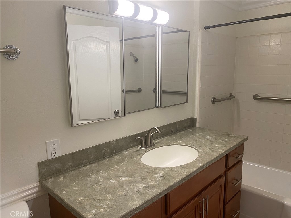 430 Buttonwood Drive Brea, CA 92821 - Photo 23 of 27 a bathroom with a granite countertop sink a mirror and shower