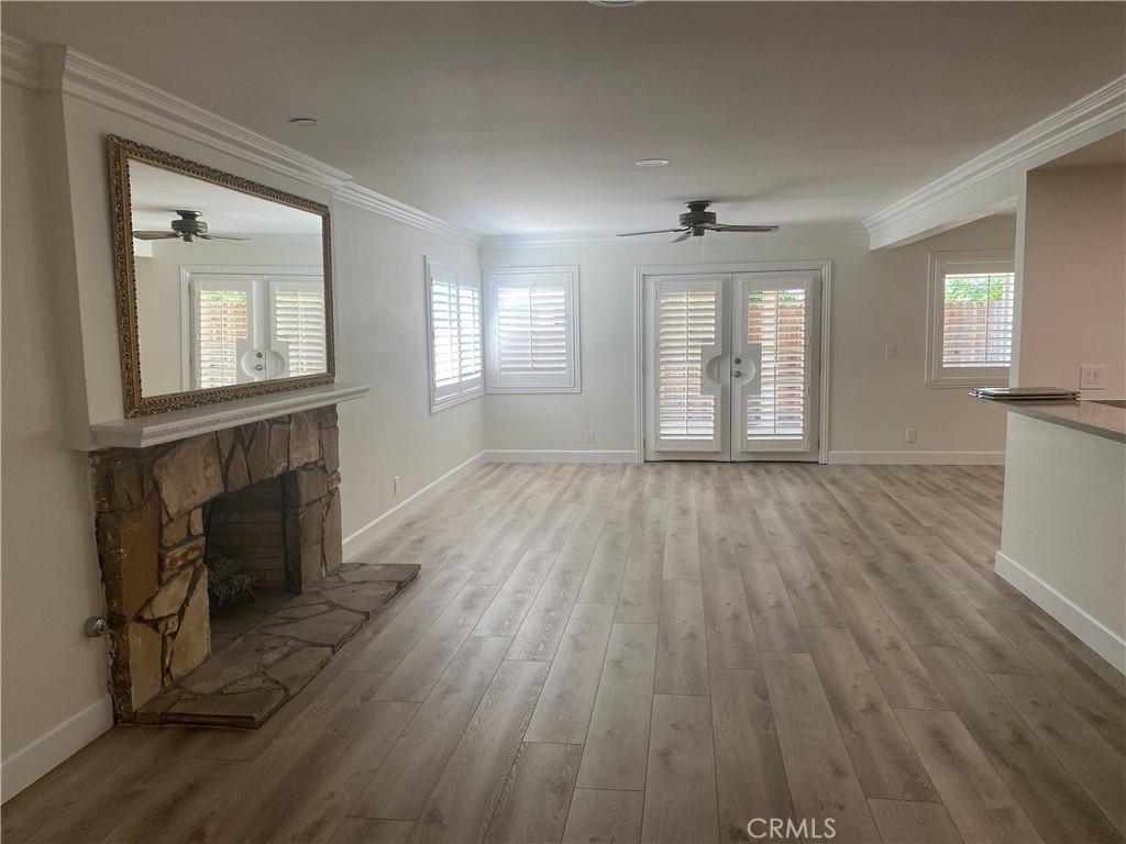 430 Buttonwood Drive Brea, CA 92821 - Photo 6 of 27 wooden floor fireplace and windows in an empty room