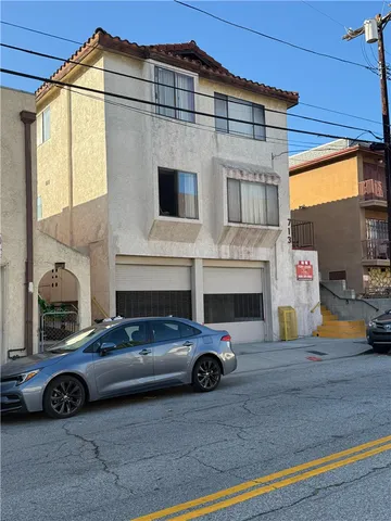 a view of a car parked in front of a building