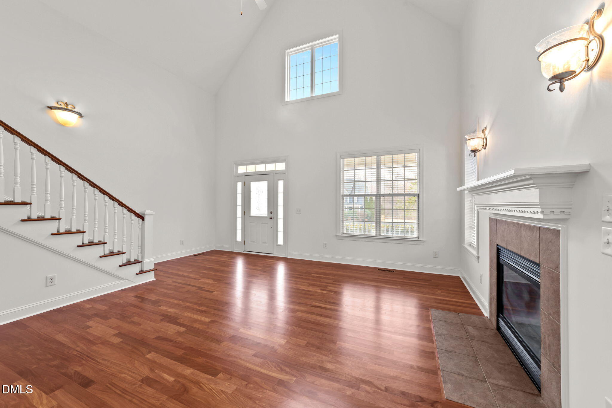7101 Numa Circle Willow Spring, NC 27592 - Photo 5 of 44 a view of an empty room with wooden floor fireplace and a window