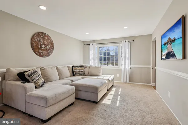 a living room with a couch and a window