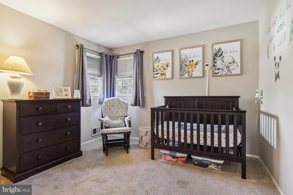 a bed room with a bed and a mirror