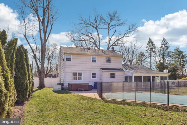 a view of backyard with swimming pool and outdoor seating