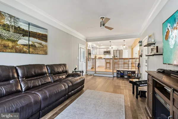 a living room with furniture and flat screen tv