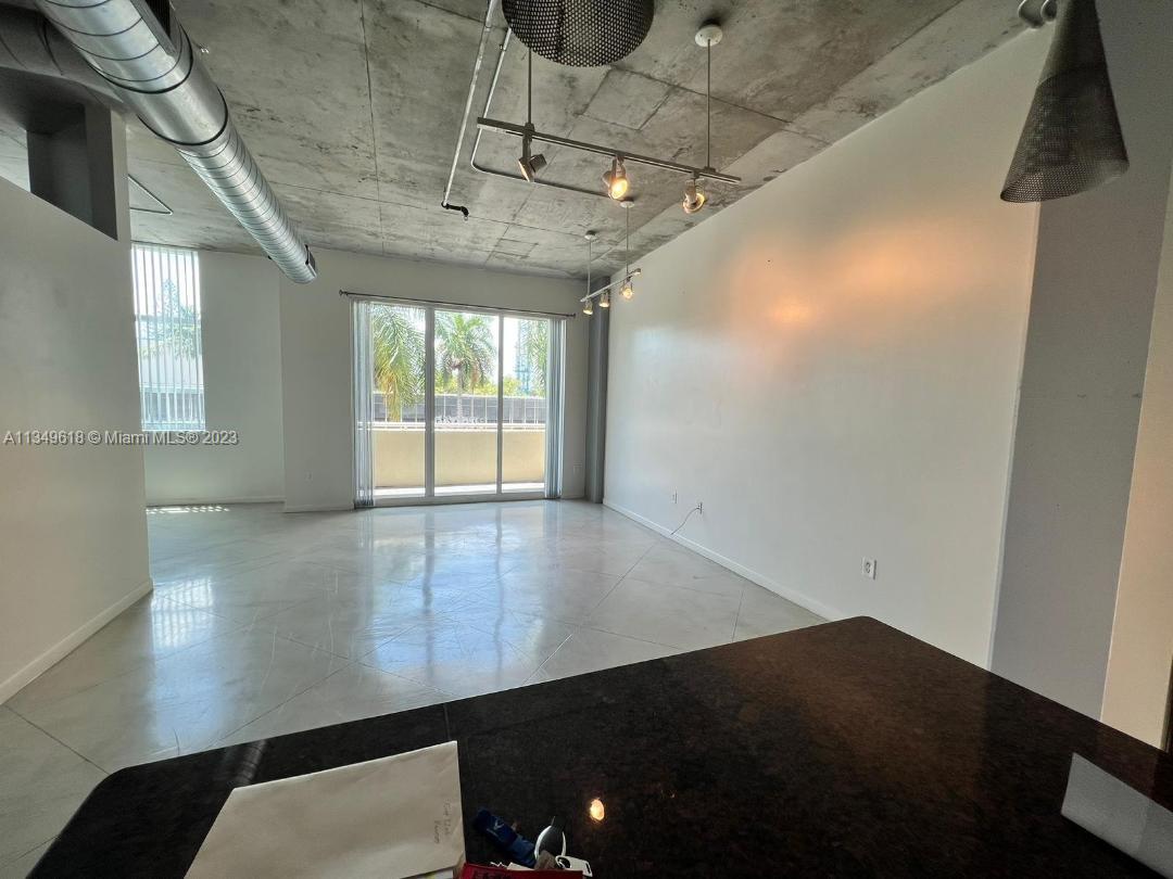 2001 Biscayne Boulevard, Unit 3206 Miami, FL 33137 - Photo 1 of 16 a view of a hallway with furniture