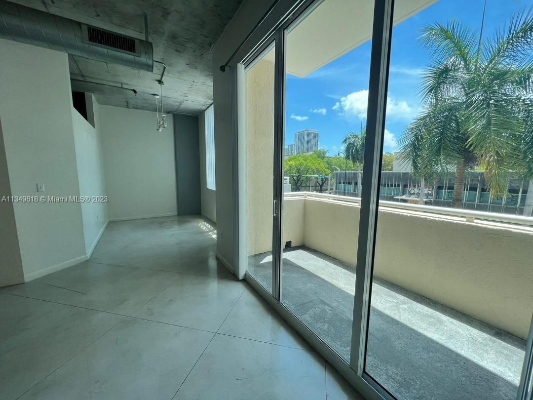2001 Biscayne Boulevard, Unit 3206 Miami, FL 33137 - Photo 4 of 16 a view of a glass door and porch