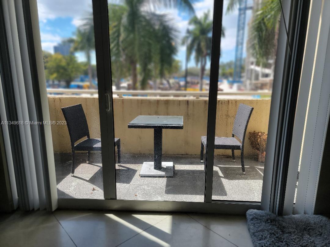 2001 Biscayne Boulevard, Unit 3206 Miami, FL 33137 - Photo 8 of 16 a view of dining room with a floor to ceiling window