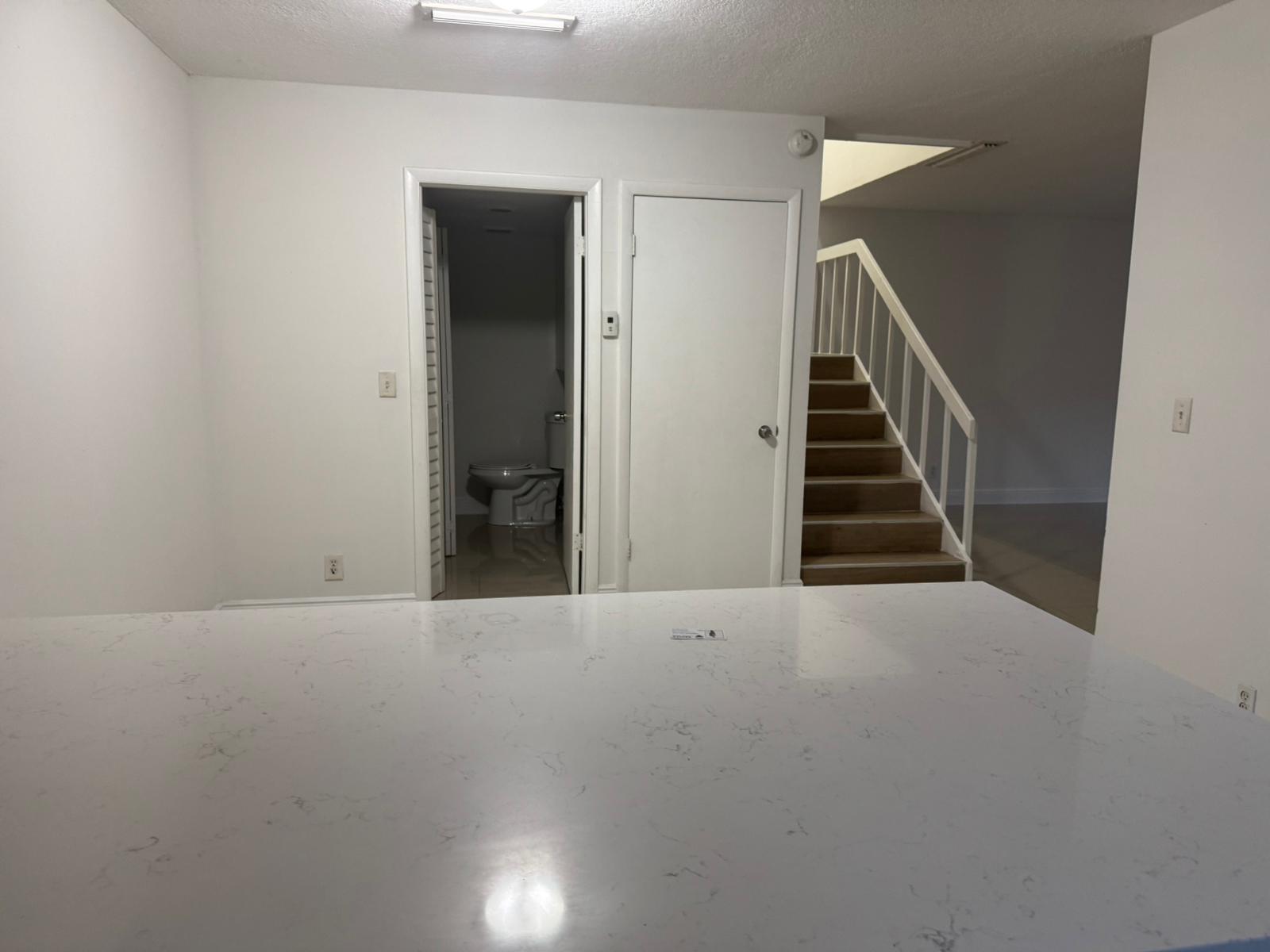 4702 Waterview Circle Palm Springs, FL 33461 - Photo 14 of 22 a view of an empty room with stairs