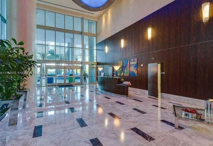 185 Southwest 7th Street, Unit 2206 Miami, FL 33130 - Photo 4 of 12 a lobby with furniture and window