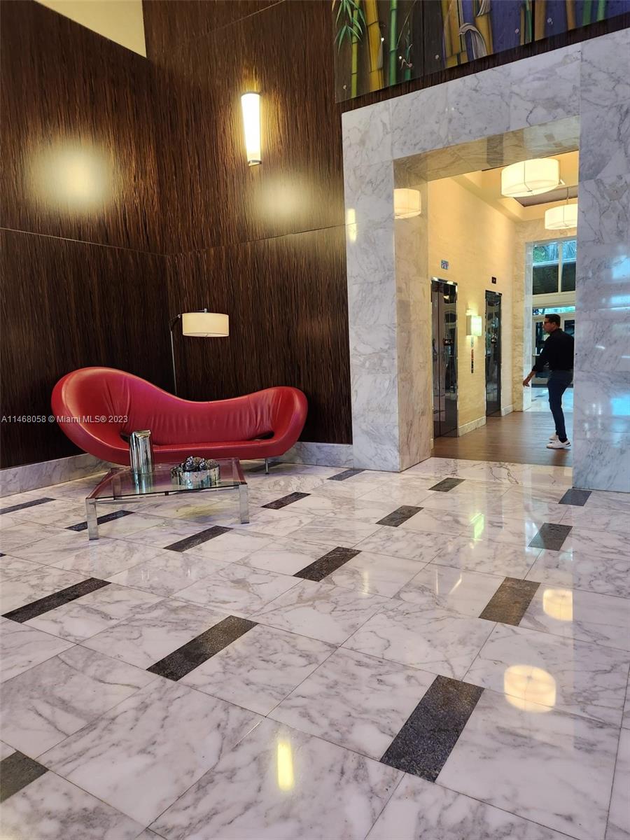 185 Southwest 7th Street, Unit 2206 Miami, FL 33130 - Photo 5 of 12 a view of a hallway with dining area
