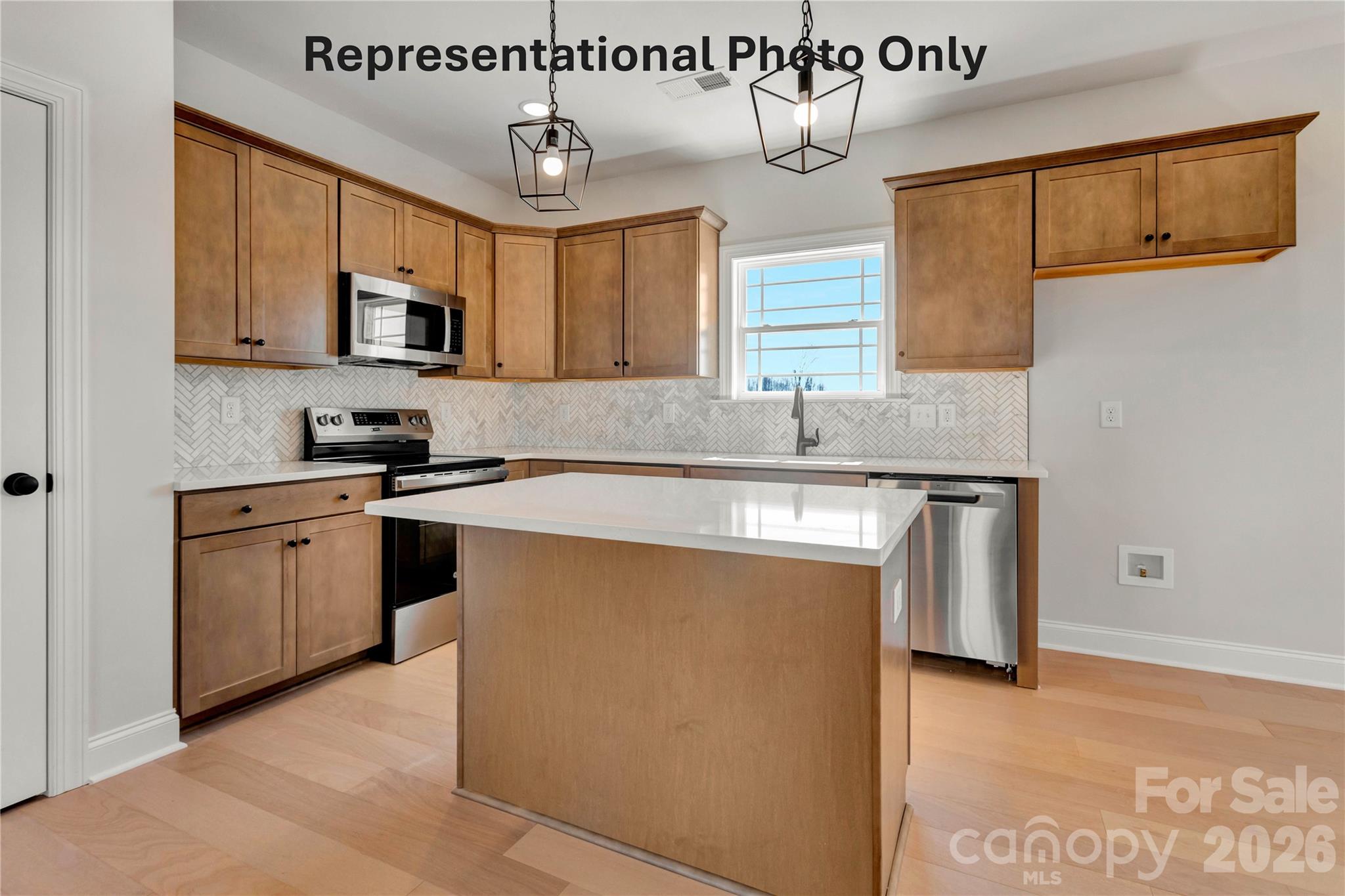 265 Bob Friday Road Dallas, NC 28034 - Photo 5 of 13 a kitchen with stainless steel appliances granite countertop a sink and a stove