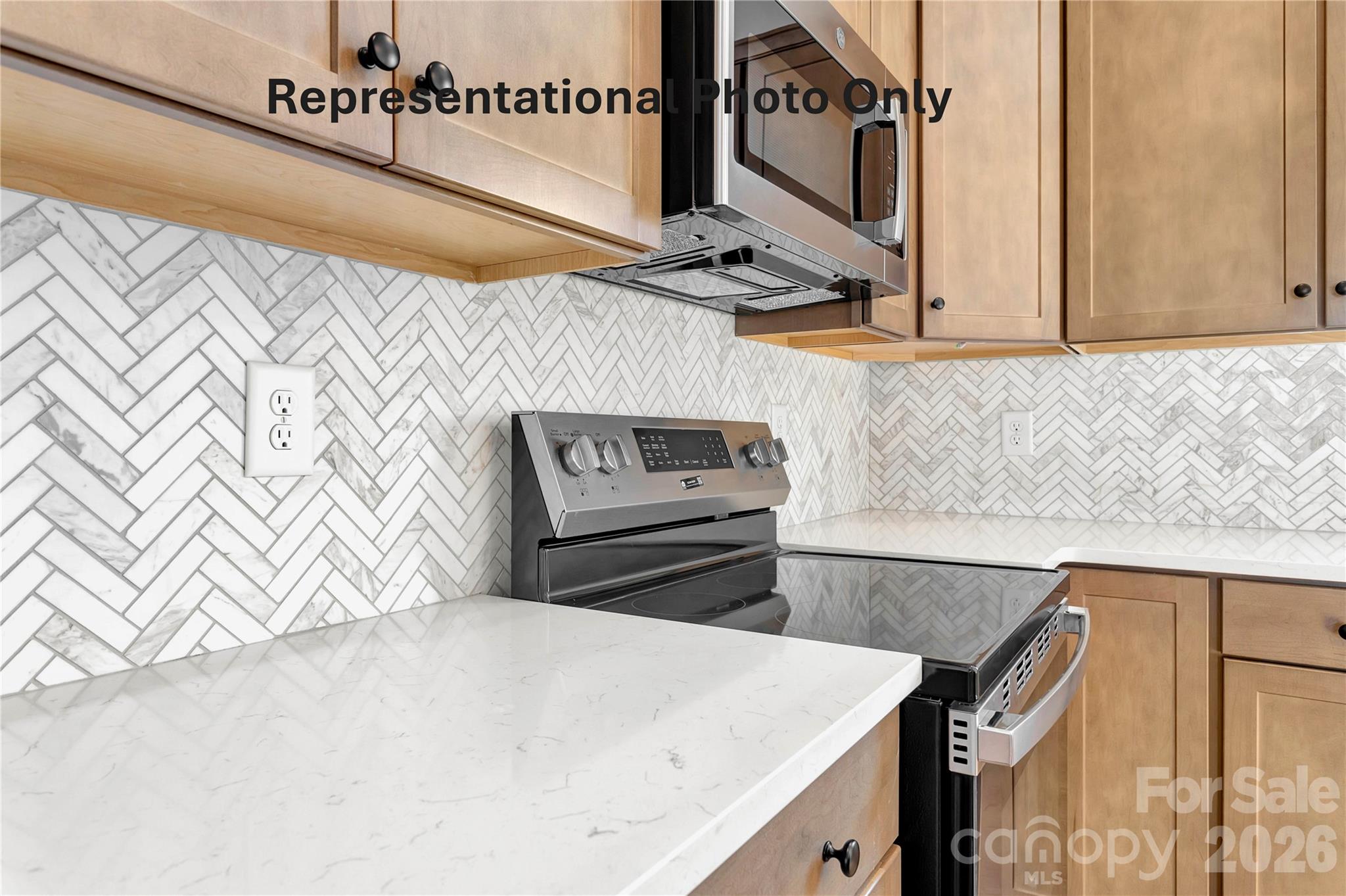 265 Bob Friday Road Dallas, NC 28034 - Photo 7 of 13 a kitchen with a sink and a microwave