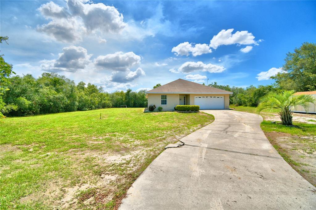 62 Deer Road Frostproof, FL 33843 - Photo 1 of 1 a view of a house with a yard