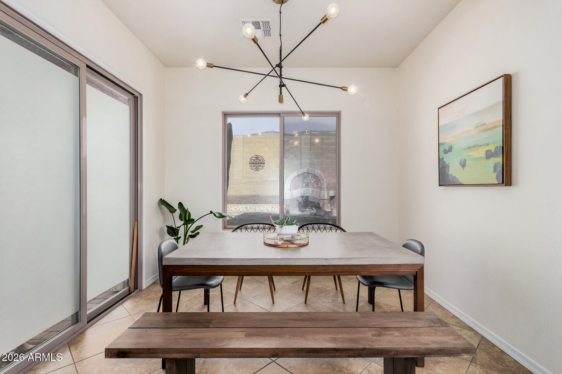 5606 West Desperado Way Phoenix, AZ 85083 - Photo 12 of 43 a view of a dining room with furniture and wooden floor
