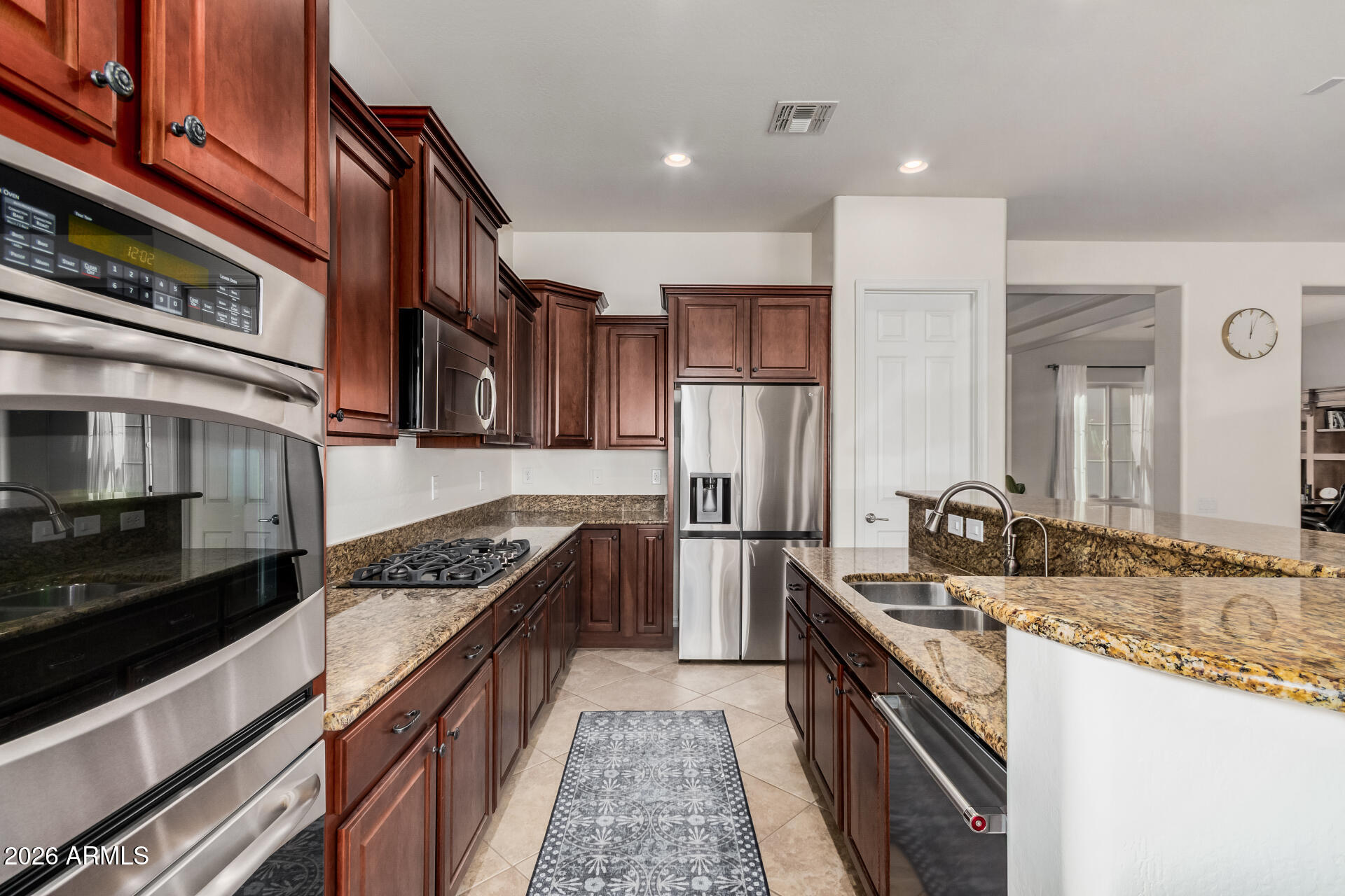 5606 West Desperado Way Phoenix, AZ 85083 - Photo 14 of 43 a kitchen with stainless steel appliances granite countertop a stove and a sink