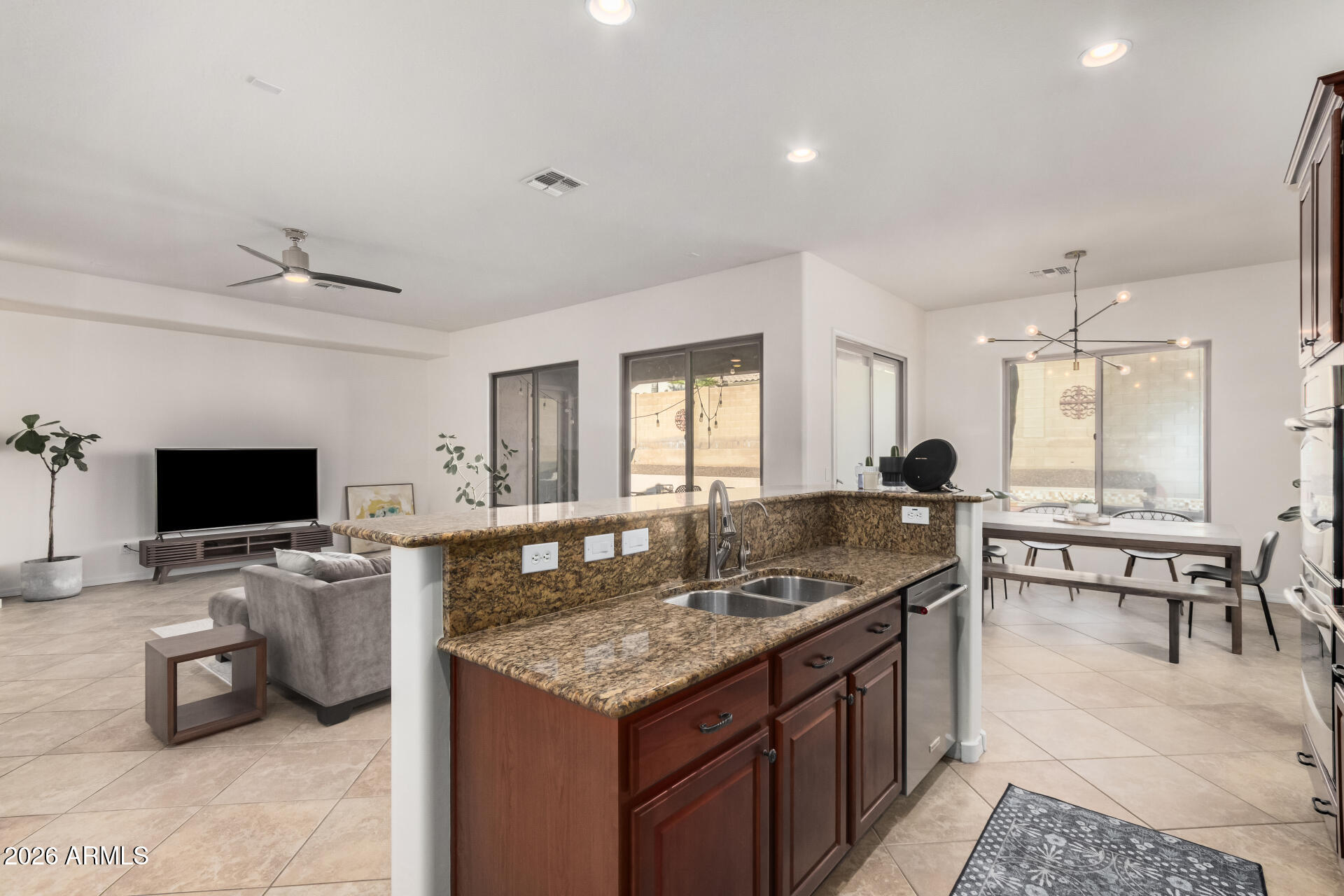 5606 West Desperado Way Phoenix, AZ 85083 - Photo 15 of 43 a kitchen with a stove a sink and a refrigerator