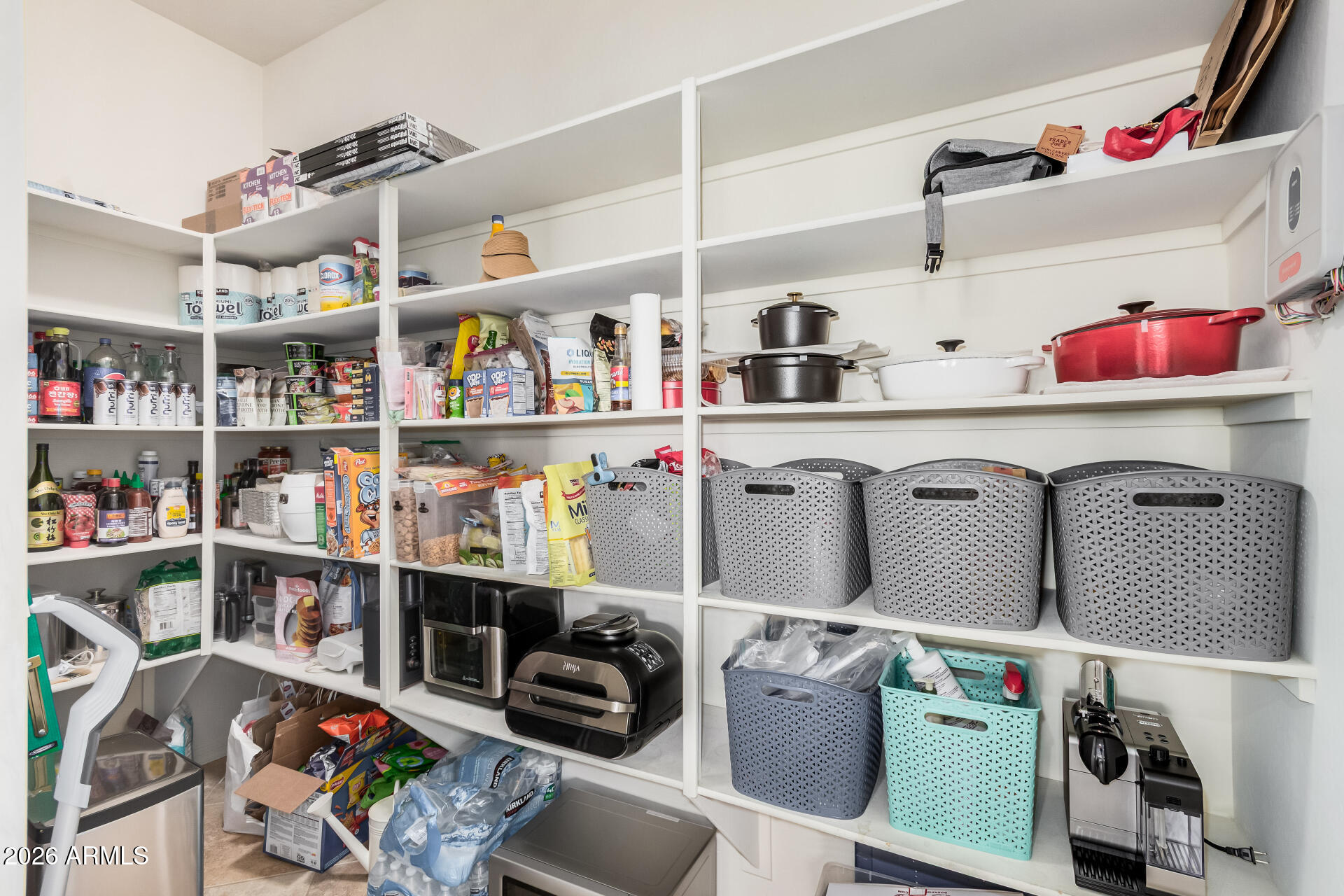 5606 West Desperado Way Phoenix, AZ 85083 - Photo 16 of 43 a utility room with lots of clutter and cabinets
