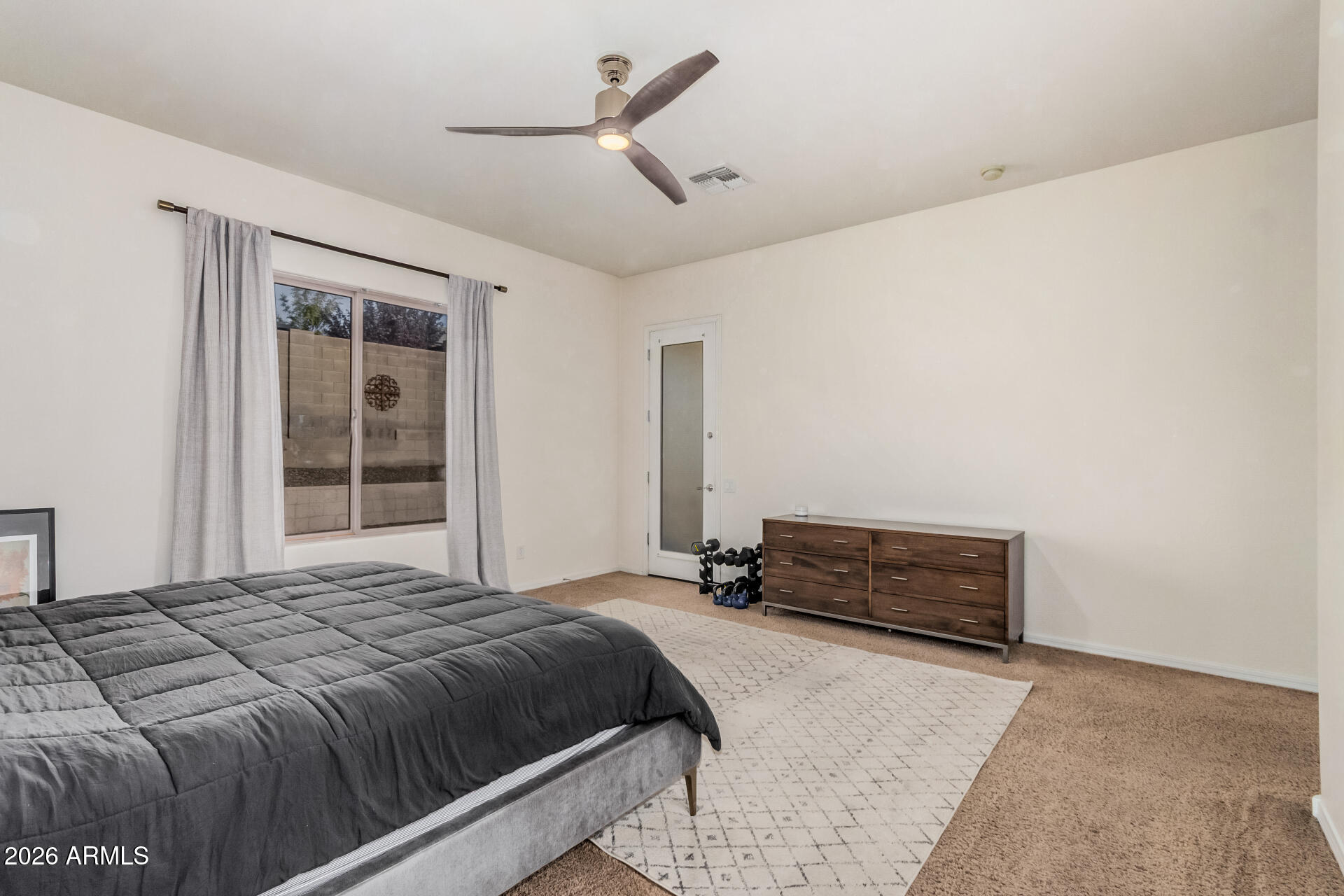 5606 West Desperado Way Phoenix, AZ 85083 - Photo 20 of 43 a bedroom with a bed and a window