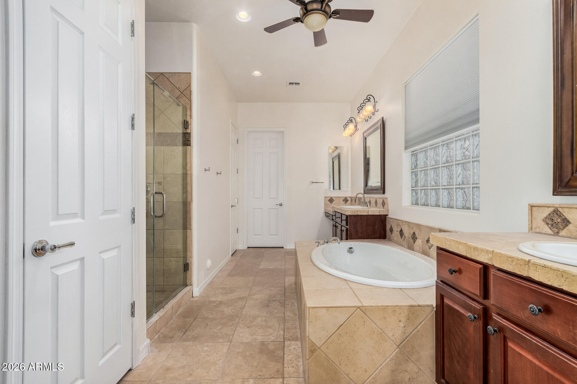 5606 West Desperado Way Phoenix, AZ 85083 - Photo 21 of 43 a bathroom with a sink a tub and a mirror