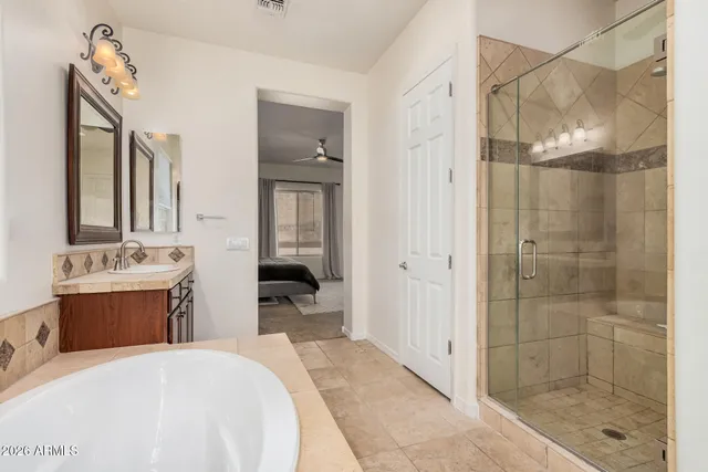 a room with a bed and a mirror