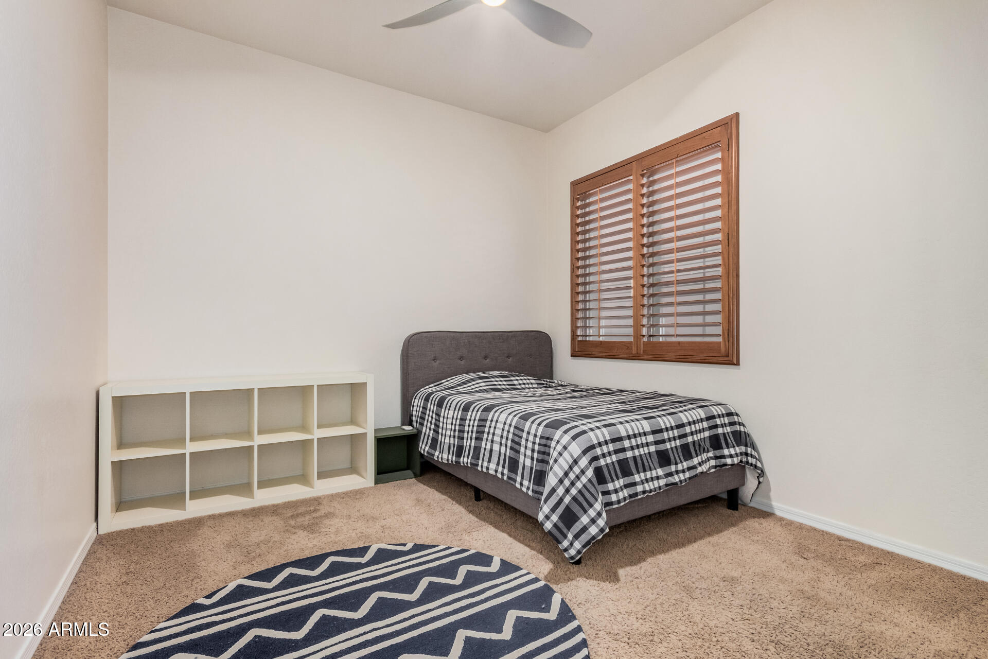 5606 West Desperado Way Phoenix, AZ 85083 - Photo 24 of 43 a bedroom with a bed and a window