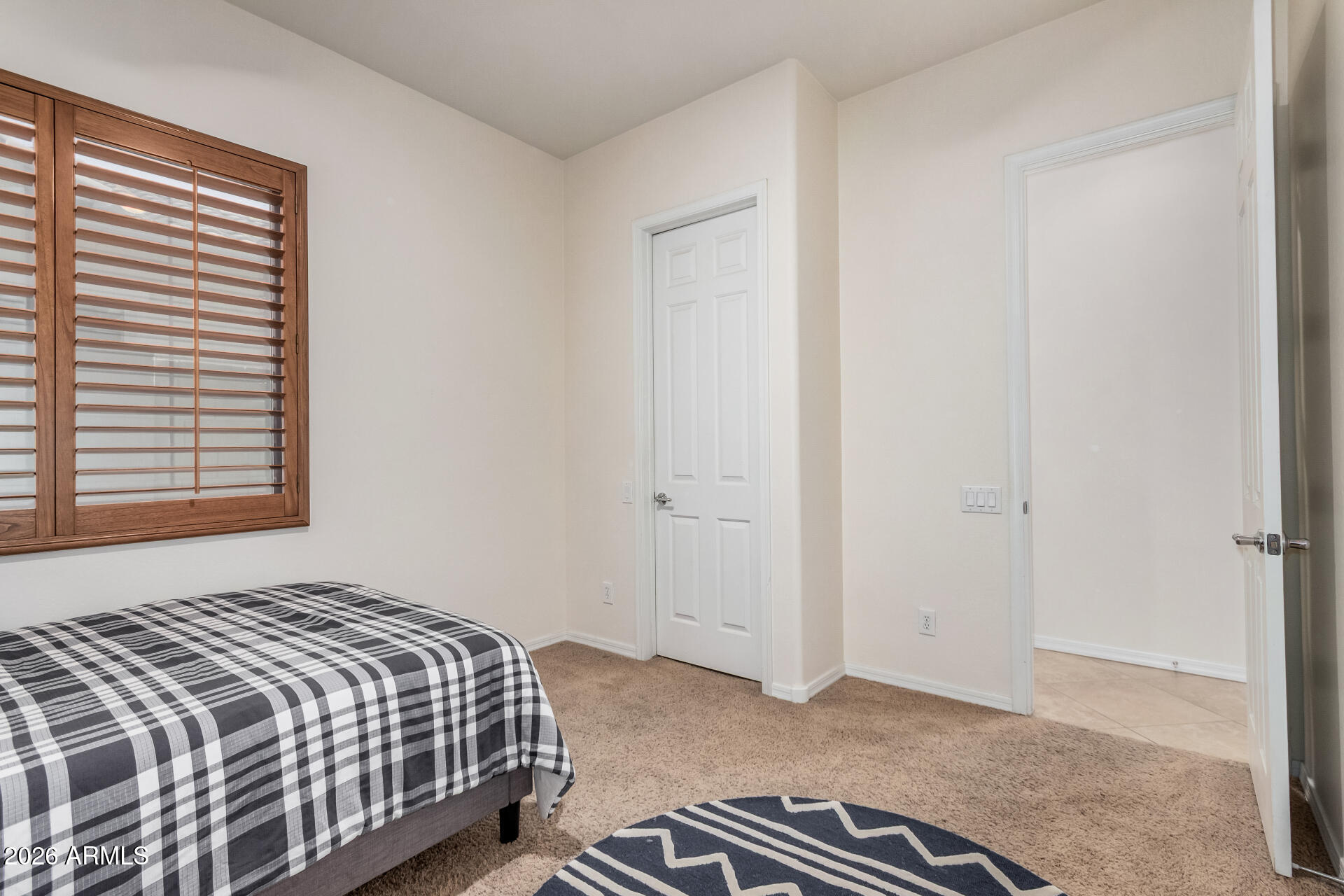 5606 West Desperado Way Phoenix, AZ 85083 - Photo 25 of 43 a bedroom with a bed and a window