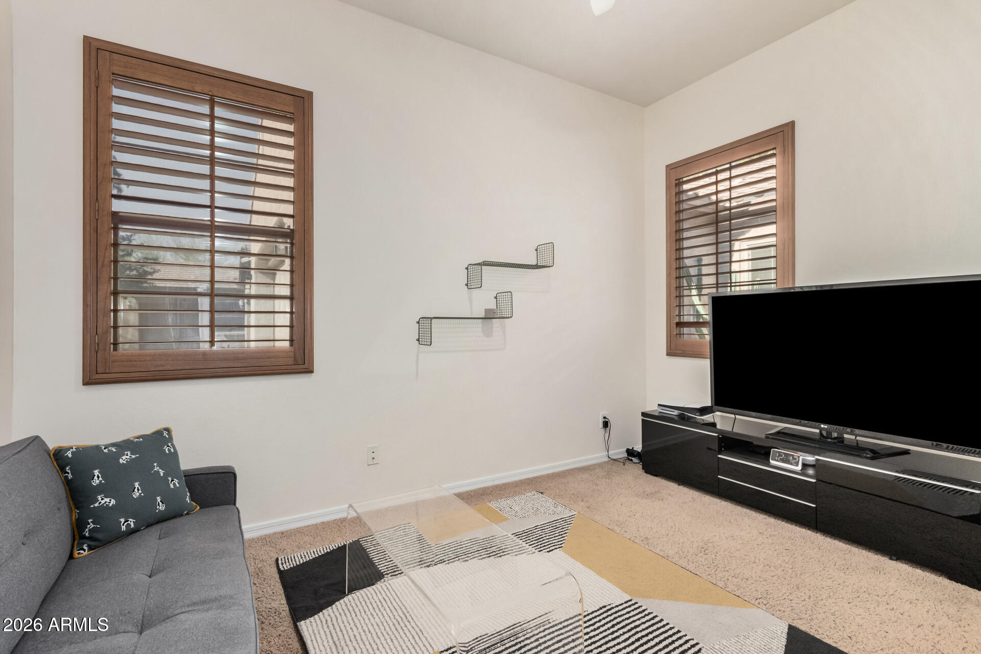5606 West Desperado Way Phoenix, AZ 85083 - Photo 27 of 43 a living room with furniture and a flat screen tv