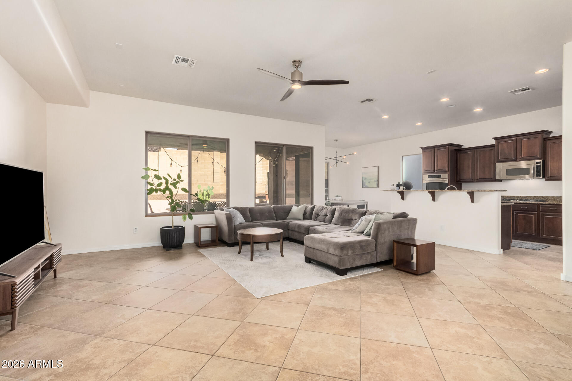5606 West Desperado Way Phoenix, AZ 85083 - Photo 7 of 43 a living room with furniture and a flat screen tv