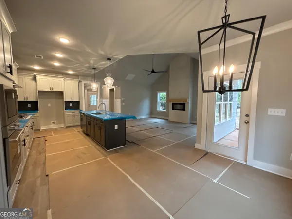 a kitchen with stainless steel appliances a refrigerator and microwave