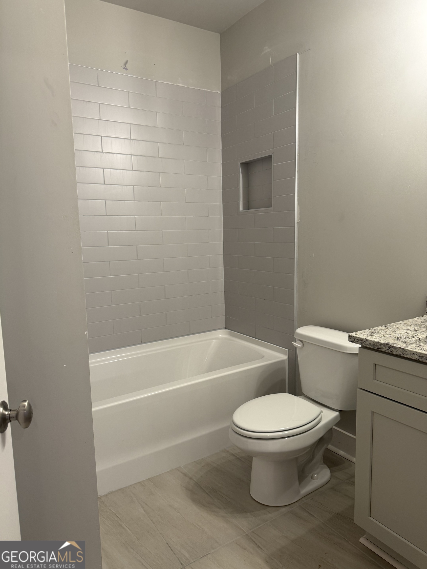 396 Tanners Bridge Road Bethlehem, GA 30620 - Photo 6 of 11 a white toilet and tub sitting next to a bathroom sink