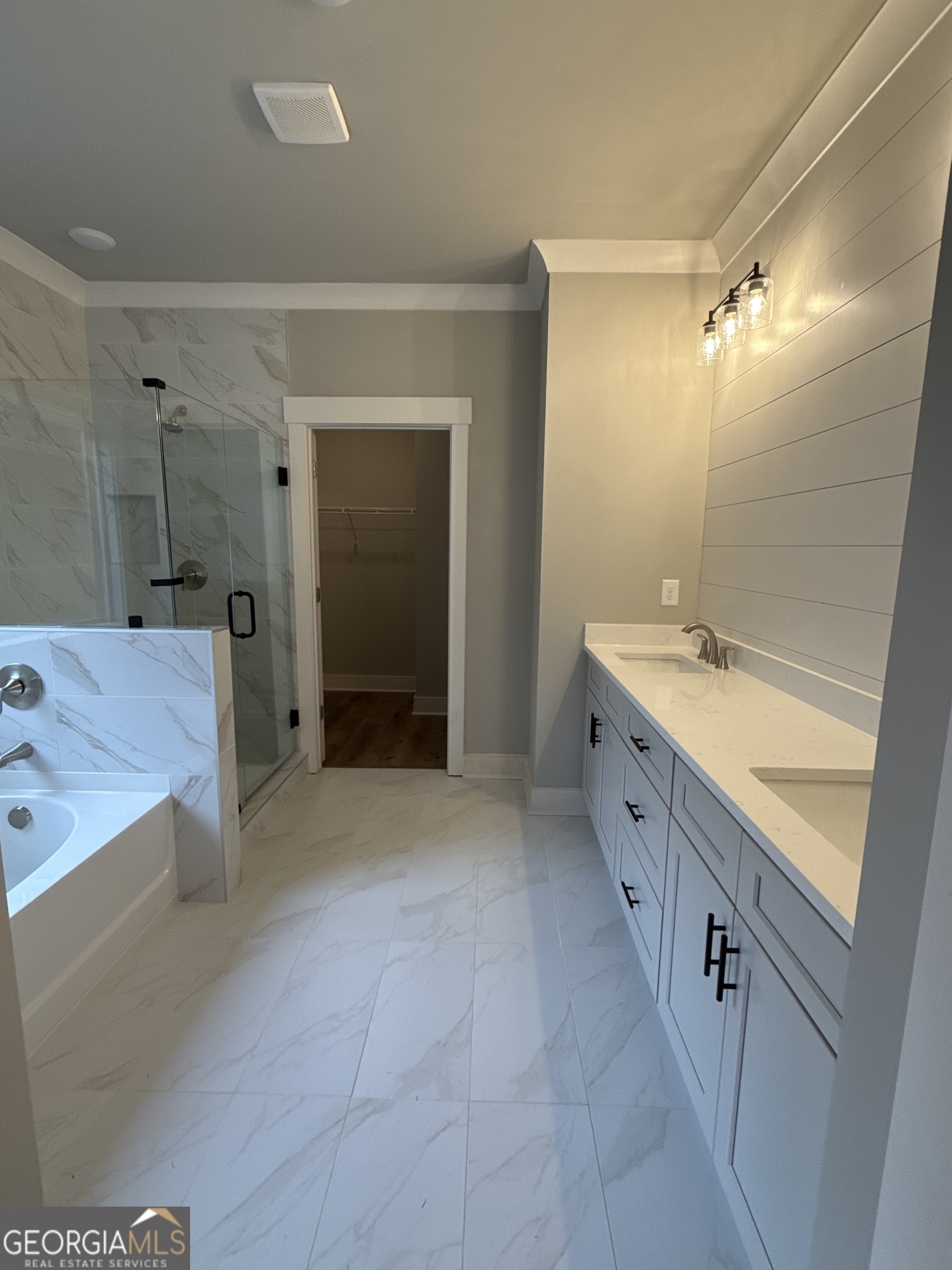 396 Tanners Bridge Road Bethlehem, GA 30620 - Photo 9 of 11 a spacious bathroom with a double vanity sink tub double and mirror