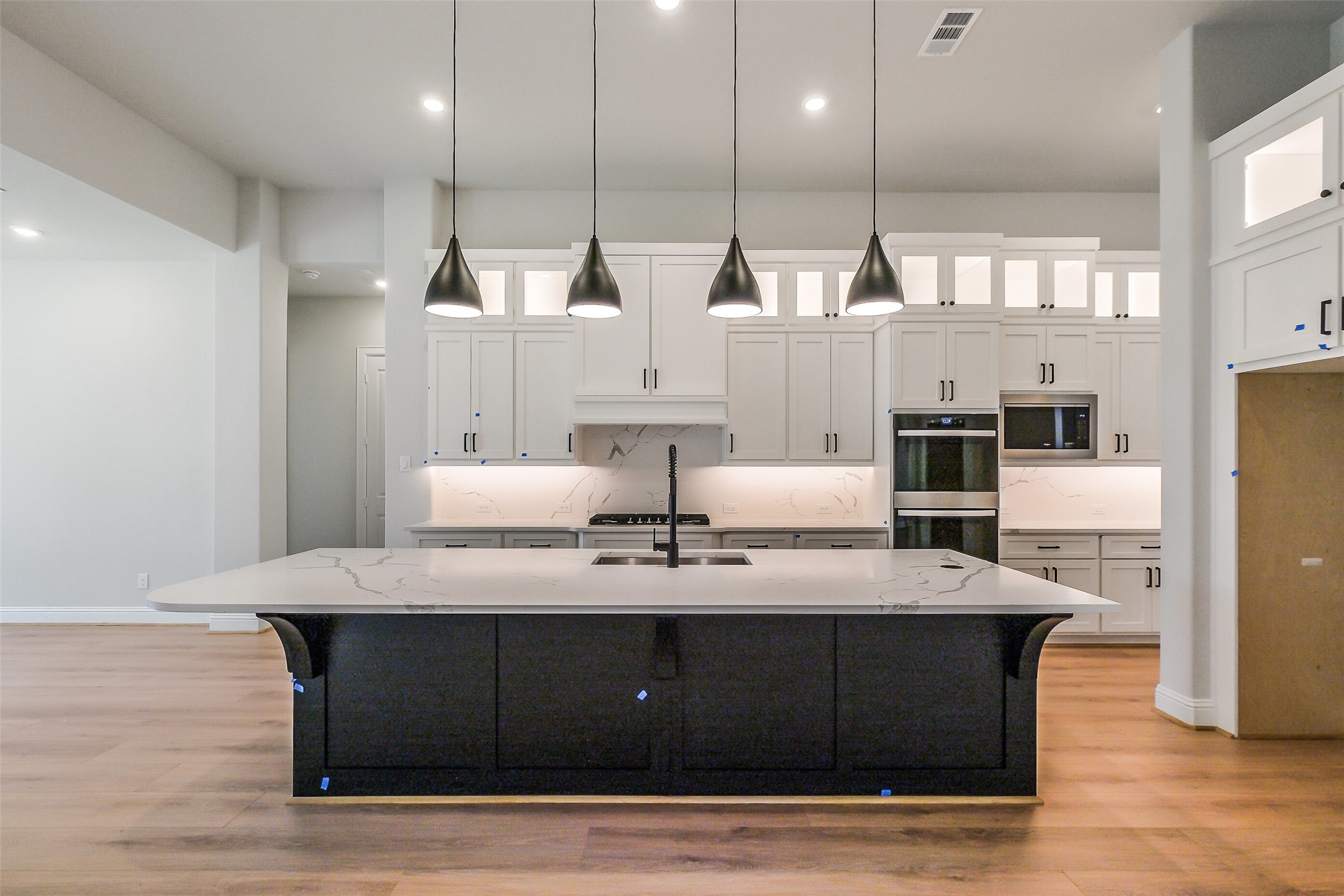 12965 Whitewater Way Conroe, TX 77302 - Photo 11 of 50 a living room with kitchen island granite countertop furniture a large window and kitchen view