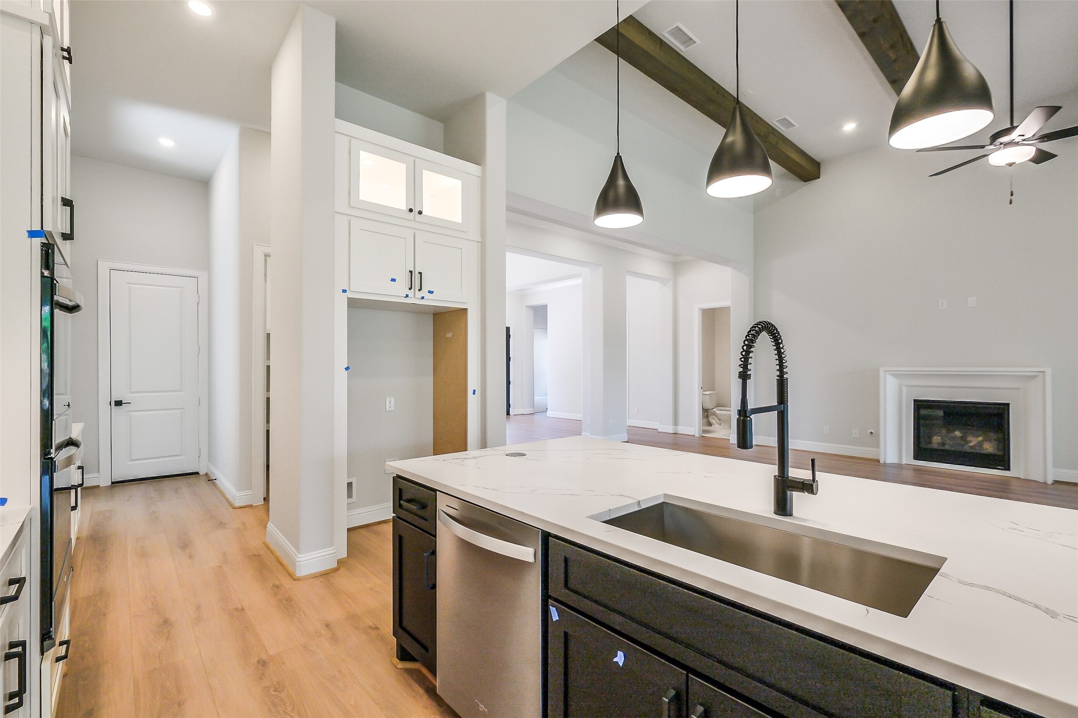 12965 Whitewater Way Conroe, TX 77302 - Photo 13 of 50 a kitchen with a sink and a refrigerator
