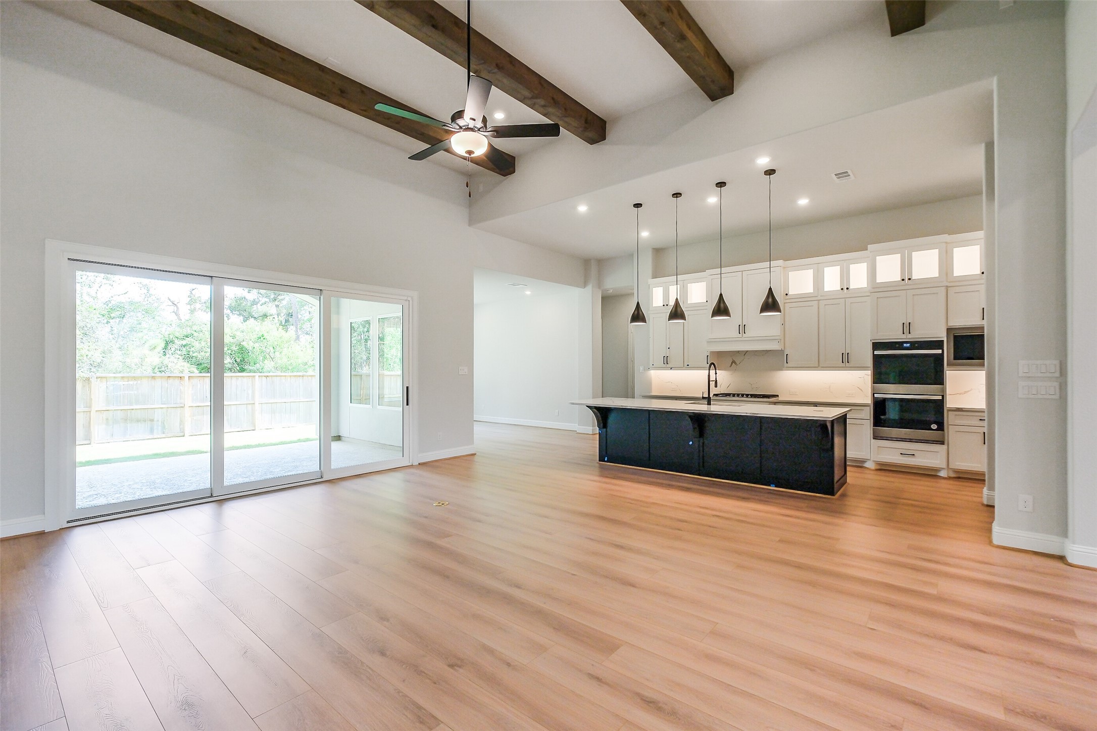 12965 Whitewater Way Conroe, TX 77302 - Photo 18 of 50 a large white kitchen with a large window