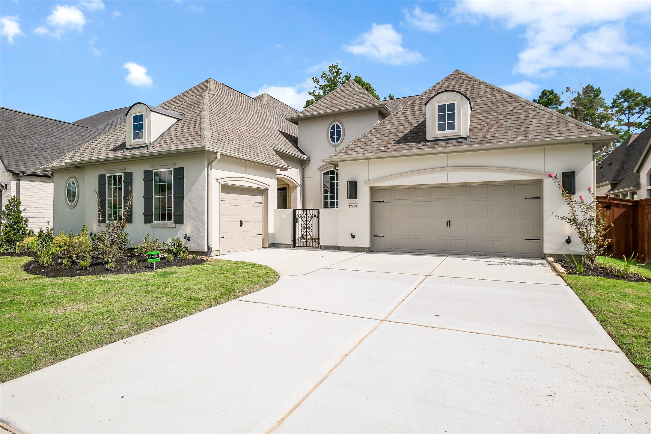 12965 Whitewater Way Conroe, TX 77302 - Photo 2 of 50 a front view of a house with garden